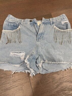 Francesca‘s jean shorts with rhinestone fringe